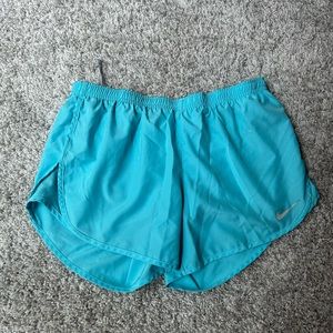 Blue Nike dry fit lined running shorts. Size medium.